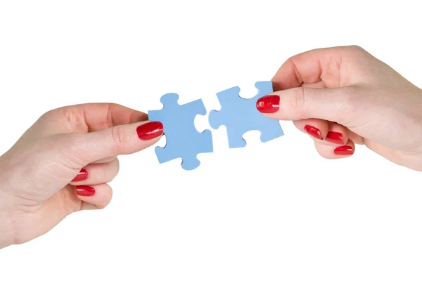 Hands with different pieces of puzzle — Stock Photo, Image