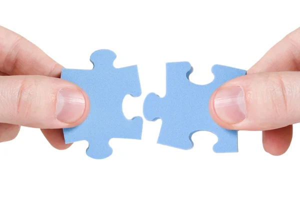 Connecting different pieces of puzzle — Stock Photo, Image