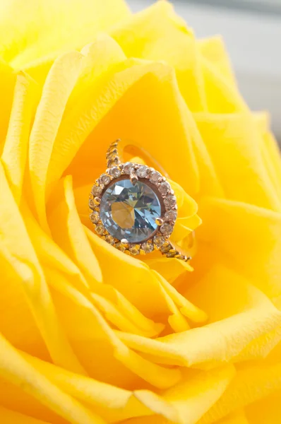 Golden ring with blue topaz Stock Photo