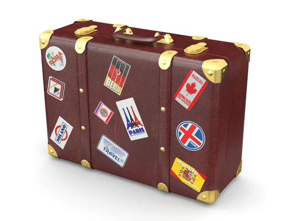 Hnědý kožený kufr cestovní nálepky — Stock fotografie