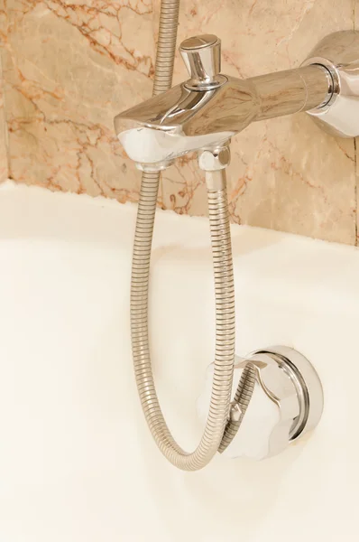 Faucet with handles and white bath — Stock Photo, Image