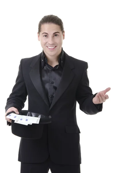 Magician with money in top hat — Stock Photo, Image