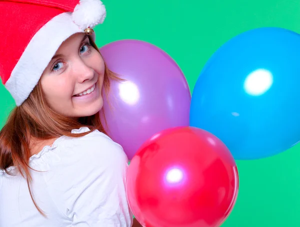 Sedutor menina segurando vibrantes balões — Fotografia de Stock