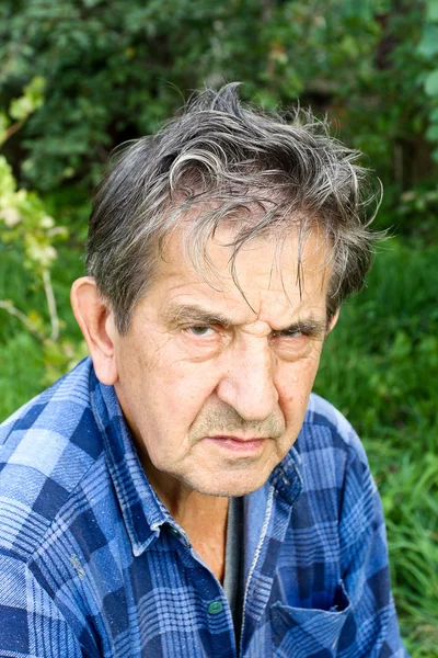 Portrait of a sad senior man in nature — Stock Photo, Image