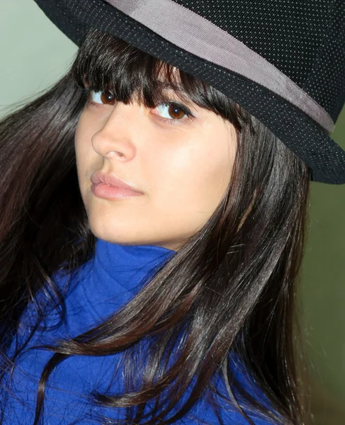 Cute brunette girl with black hat — Stock Photo, Image