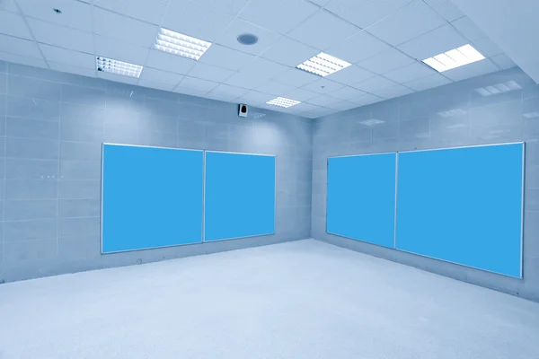 Modern hall with blue placards — Stock Photo, Image