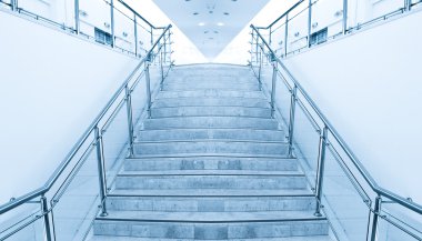 Modern staircase in office center clipart