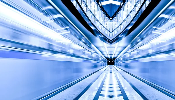 Vivid symmetric illuminated metro station with marble floor — Stock Photo, Image