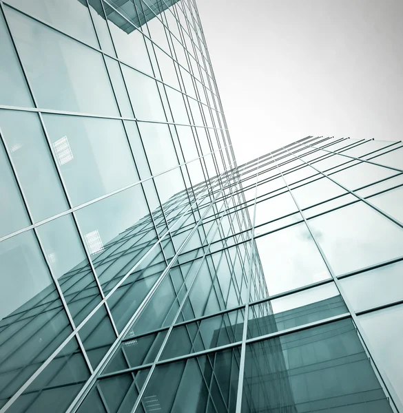 Turquoise glass high-rise corporate building — Stock Photo, Image