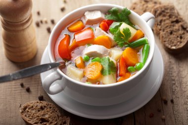 Chicken soup with vegetables clipart