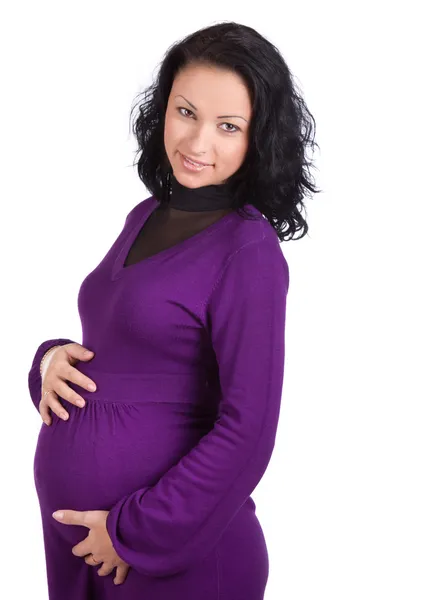 Woman in dress holding belly — Stock Photo, Image