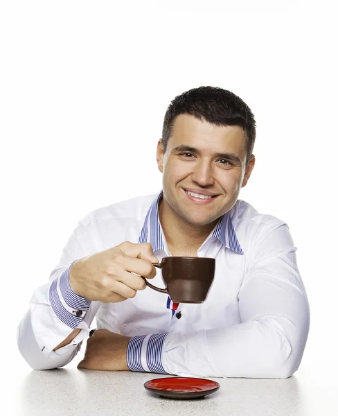 コーヒーのカップを持つ魅力的な男性の肖像画 — ストック写真