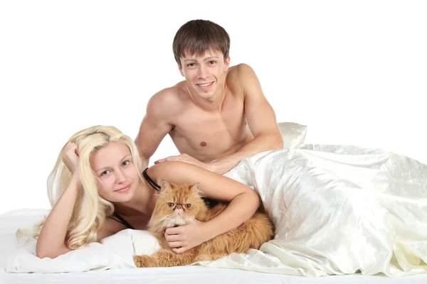 Young couple in bed Royalty Free Stock Images
