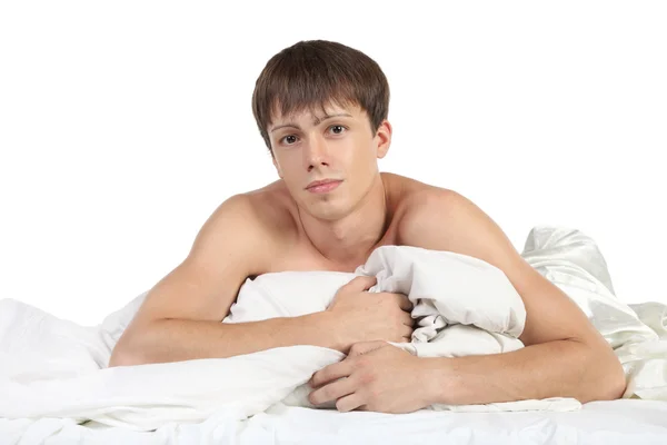 Handsome young boy lying in bed — Stock Photo, Image