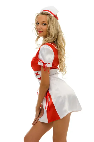 Mulher bonita em traje de carnaval. Forma de enfermeira — Fotografia de Stock