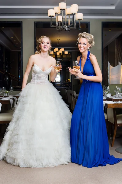 Bride and her Bridesmaid in a restaurant — Stock Photo, Image