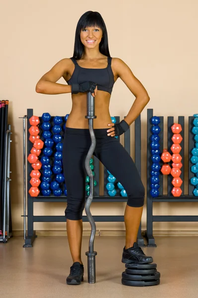 Beautiful woman who exercise in the sport club. — Stock Photo, Image