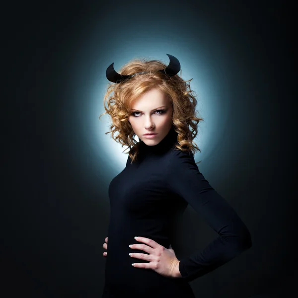 The beautiful young girl a devil — Stock Photo, Image