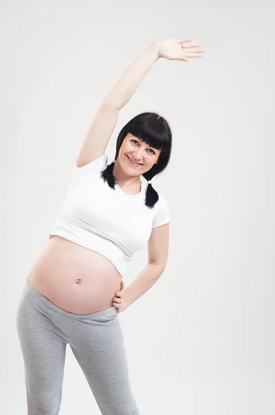 Zwangere fitness vrouw — Stok fotoğraf