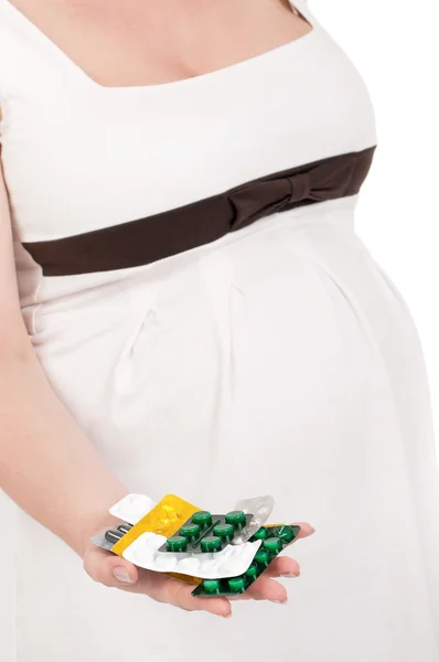 Barriga grávida com pílulas — Fotografia de Stock