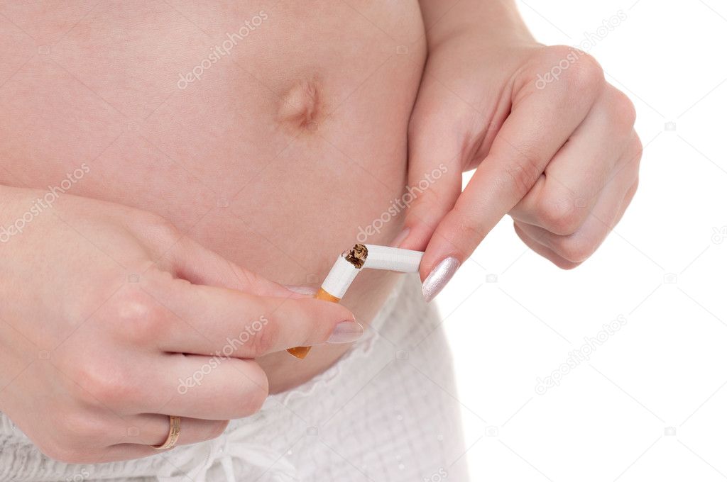 Pregnant belly with cigarettes