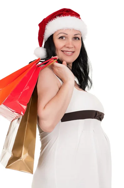 Беременная женщина с сумками — стоковое фото