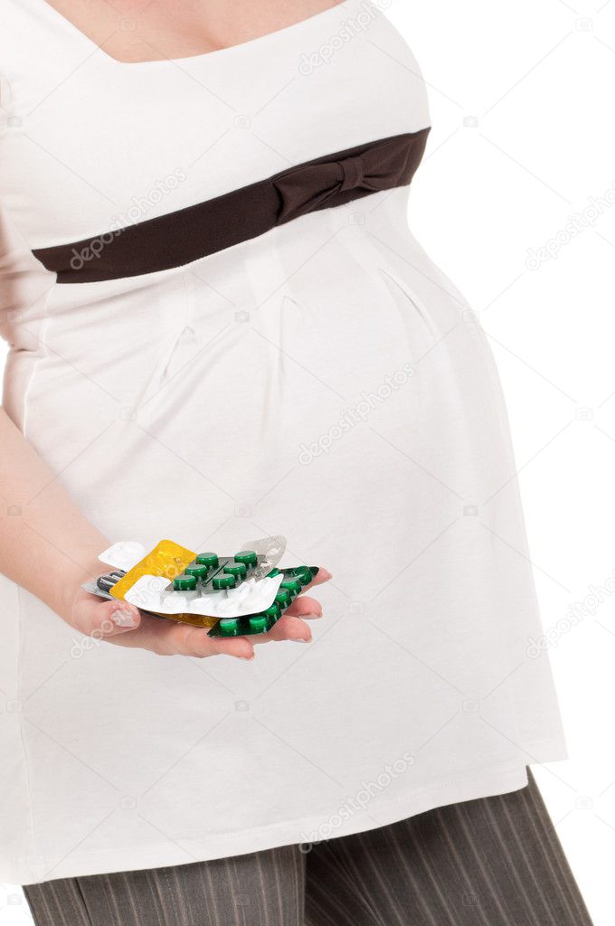 Pregnant belly with pills