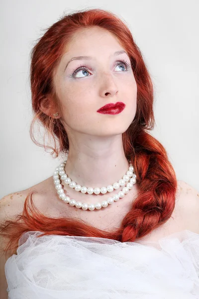 Beautiful young woman with red hair bride — Stock Photo, Image