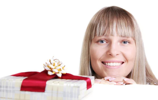 Beautiful young woman and a gift — Stock Photo, Image