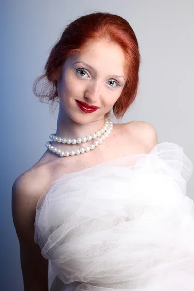 Beautiful young woman with red hair bride — Stock Photo, Image