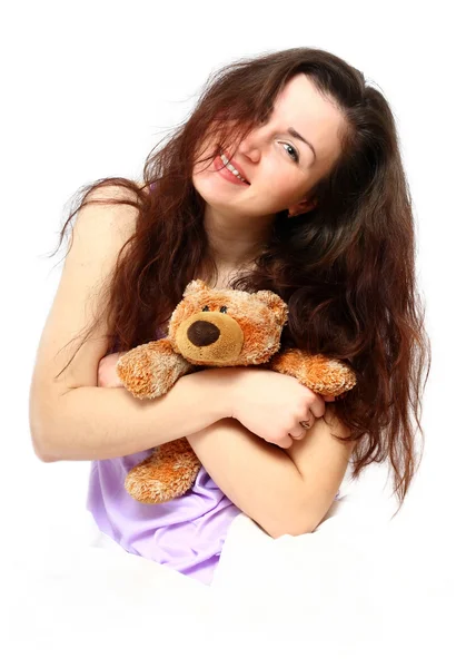 Morning portrait of a beautiful young girl with a bear — Stock Photo, Image