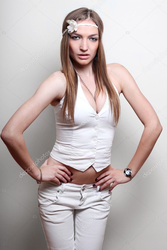 Beautiful fashionable woman on a beige background
