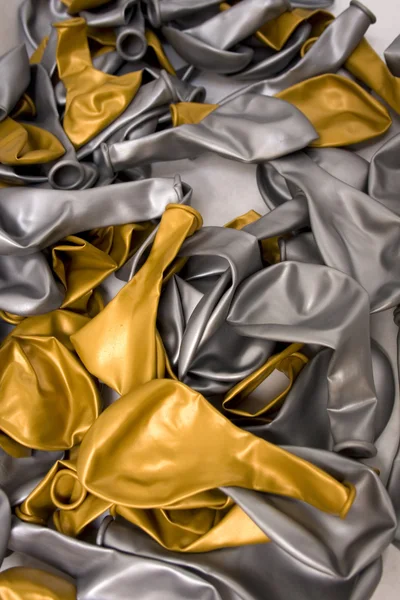 Gold and silver balloon deflated — Stok fotoğraf