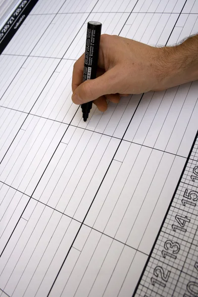 Person writing in a italian planner — Stockfoto