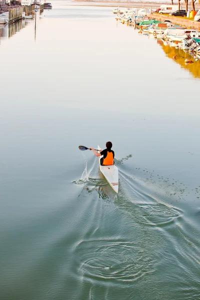 Young athlete in a canoe — Stok fotoğraf
