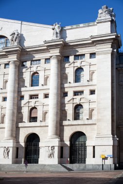 Palazzo della borsa. Exchange building on dramatic sky, Milan clipart