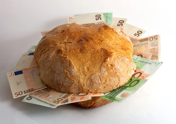 Bread with bills — Zdjęcie stockowe