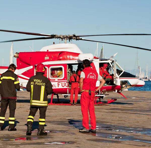 Helicopter and Italian firemans — Stock Photo, Image