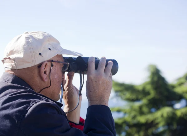 stock image Man with binoculars