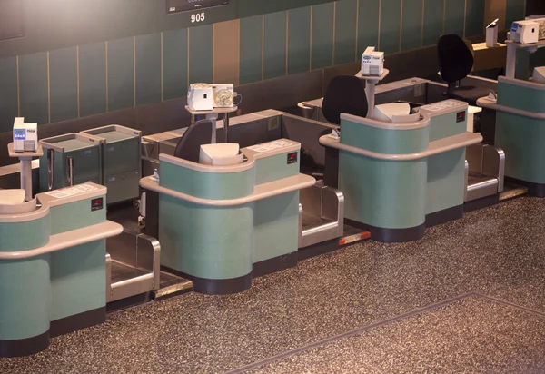Desks in airport hall — Stock Photo, Image