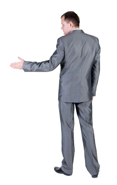 Uomo d'affari tendendo la mano a tremare. vista posteriore. — Foto Stock