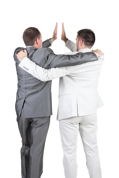 Dois empresários alegres com gesto de sucesso. vista traseira. — Fotografia de Stock