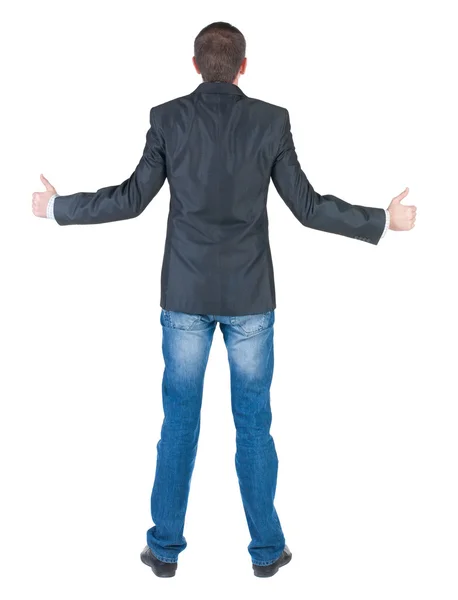 Businessman thumbs up. rear view. — Stock Photo, Image