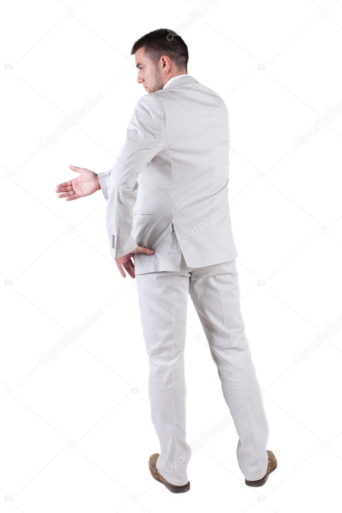 Businessman extending hand to shake. Rear view.