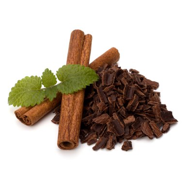 Crushed chocolate shavings pile and cinnamon sticks clipart