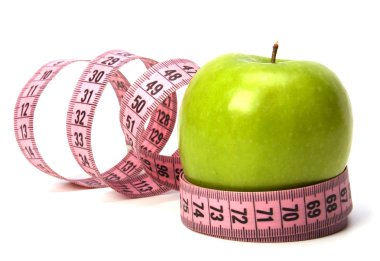 Tape measure wrapped around the apple isolated on white backgro clipart