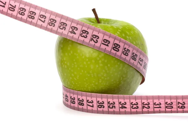 Apfel mit Maßband. Konzept eines gesunden Lebensstils. — Stockfoto