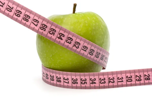 Manzana con cinta métrica. concepto de estilo de vida saludable . —  Fotos de Stock