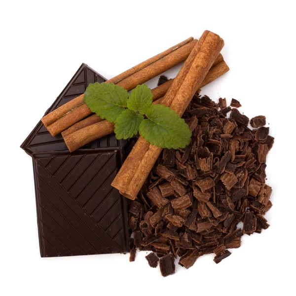 Chocolate bars and cinnamon sticks — Stock Photo, Image