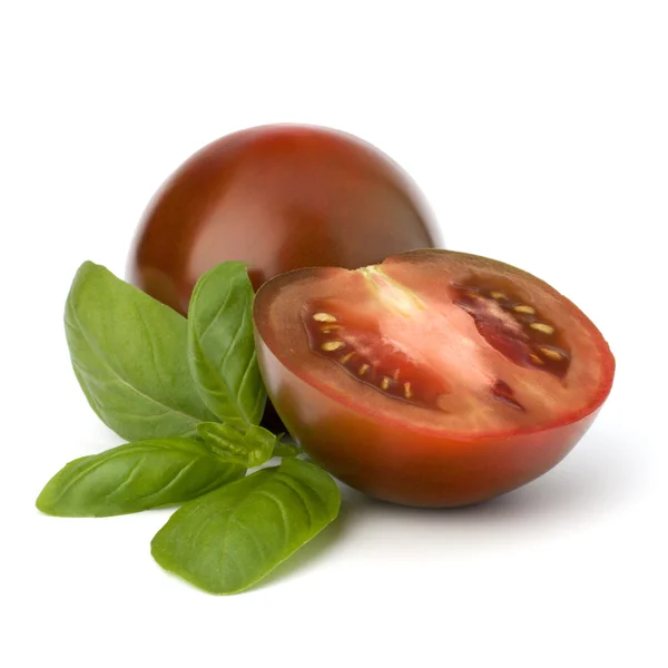 Pomidor kumato i Bazyli liść — Zdjęcie stockowe